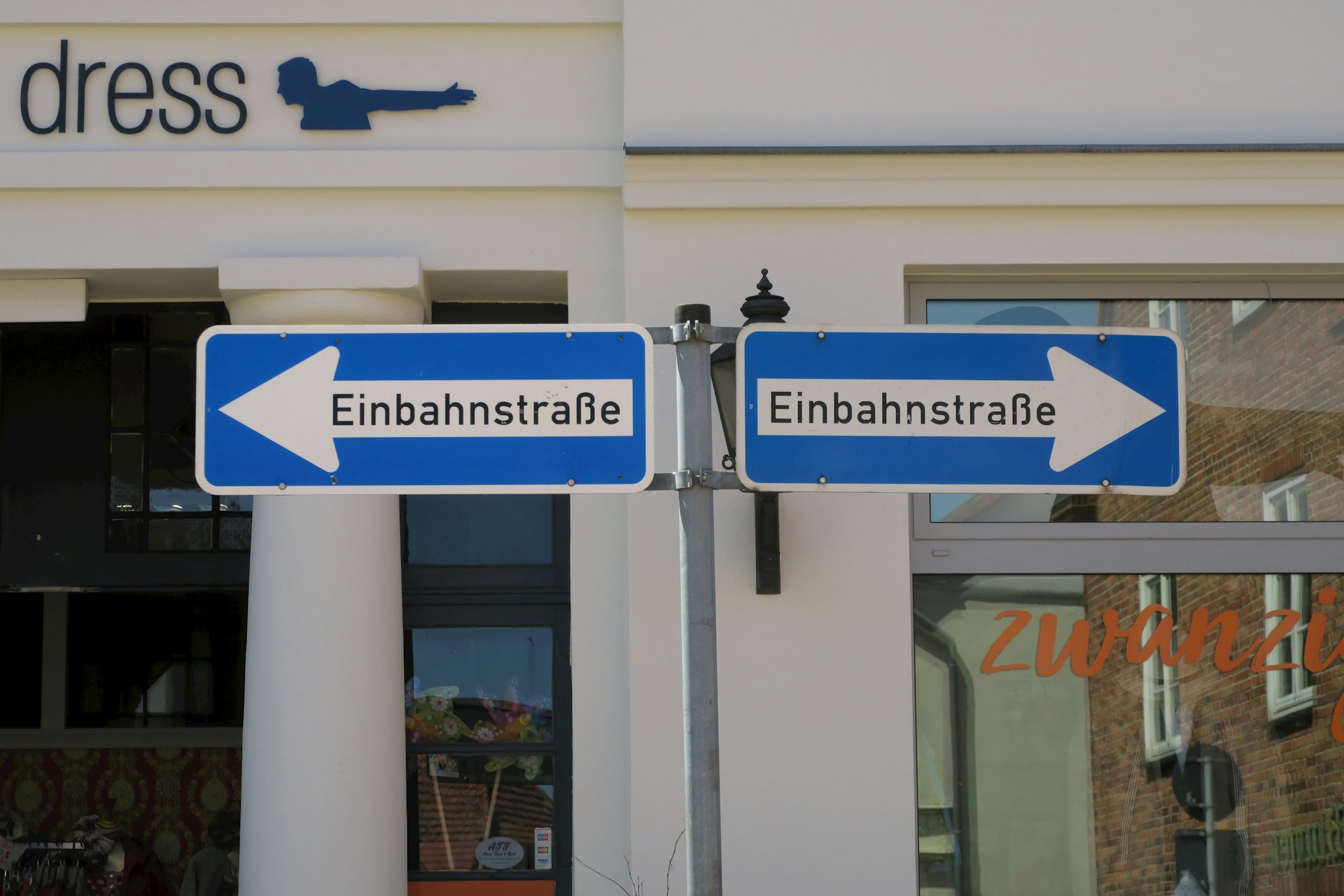 a street sign is posted on a pole